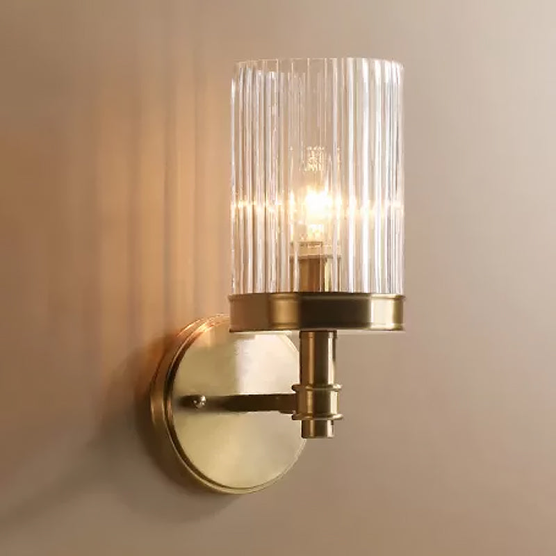 1-Light Wall Mounted Lamp Traditional Cylinder Transparent Glass Sconce Light in Brown/Gold over Bed