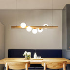 Nordic Linear Wood Island Pendant with Globe Shape Glass Island Light in Beige for Dining Room