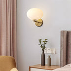Milk Glass Oval Wall Mount Lamp Modern 1 Light Bedside Wall Sconce Light in Brass