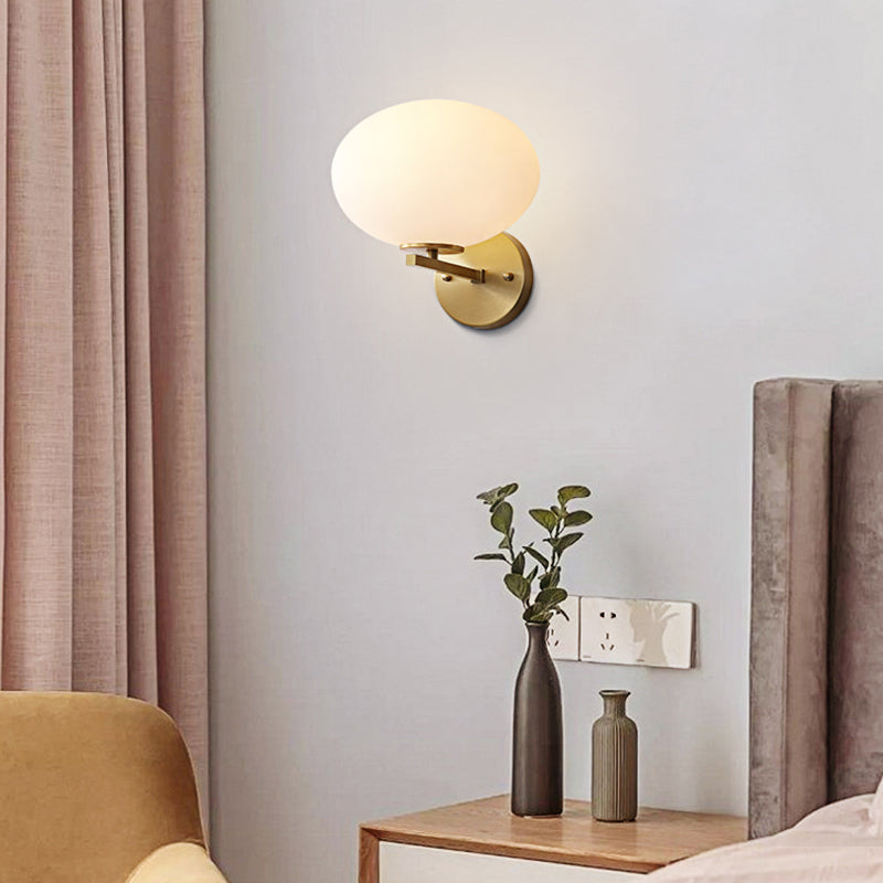 Milk Glass Oval Wall Mount Lamp Modern 1 Light Bedside Wall Sconce Light in Brass