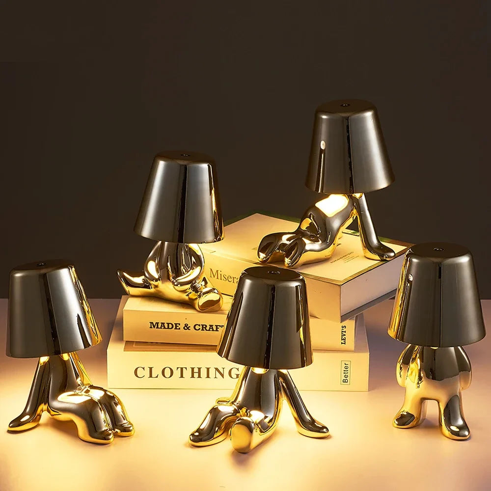 Designer LED Table Lamp Sitting Man with Glossy Finish