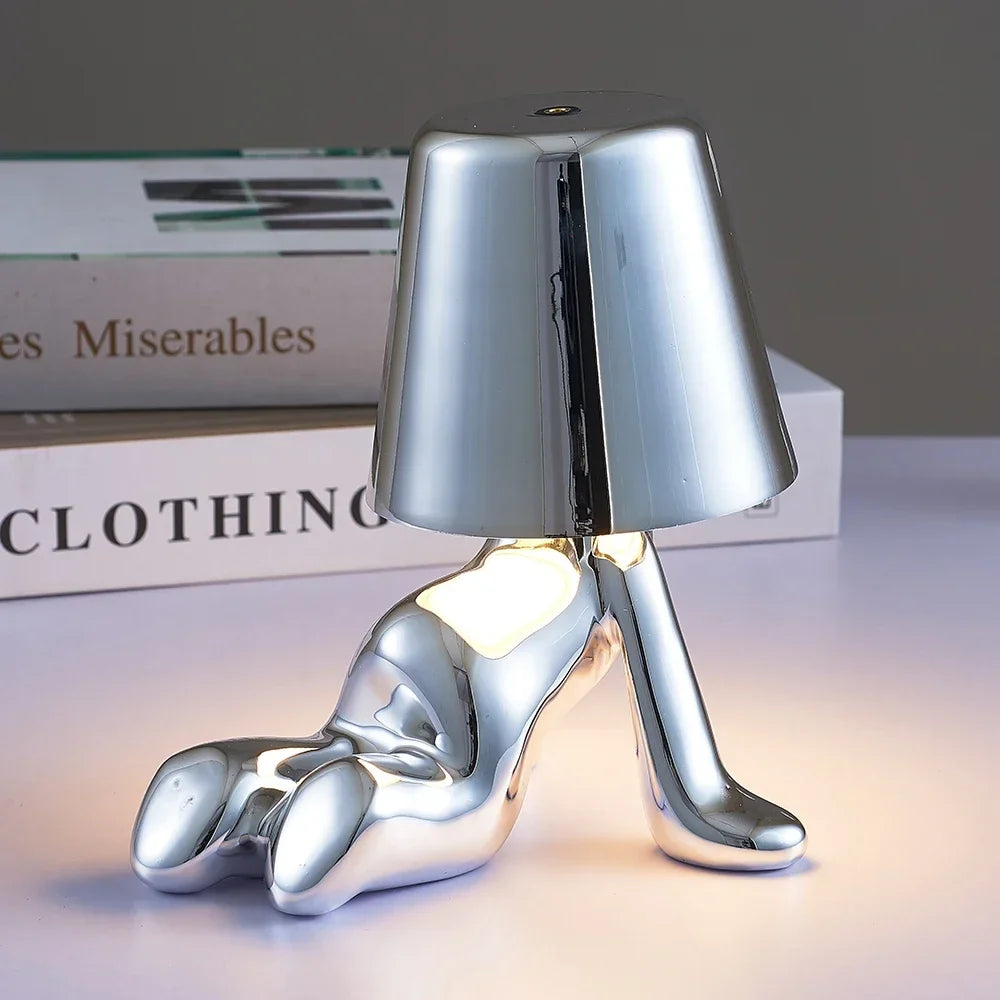 Designer LED Table Lamp Sitting Man with Glossy Finish