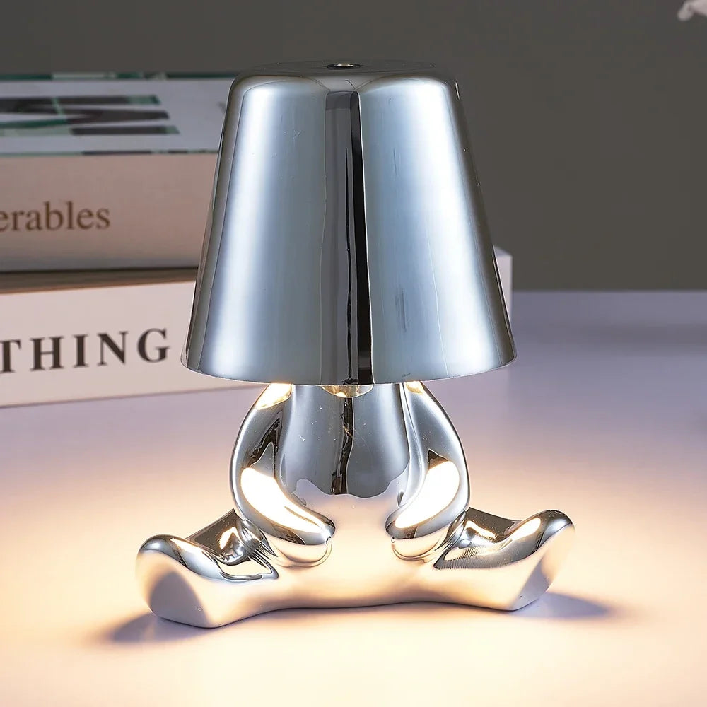 Designer LED Table Lamp Sitting Man with Glossy Finish