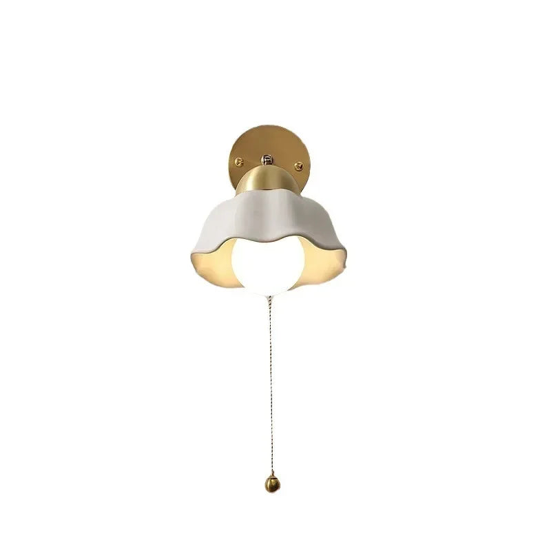 Wall lamp with wavy shade and chain
