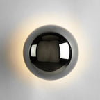 Modern LED wall sconce in the shape of a shimmering ball – wall lighting with a Bauhaus halo effect