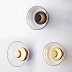 Modern wall lamp with a round shade