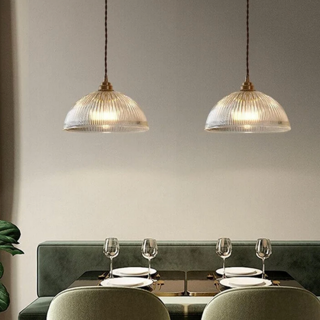 Retro-style glass pendant lamp with an embossed shade and brass finish