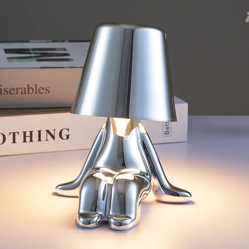 Designer LED Table Lamp Sitting Man with Glossy Finish