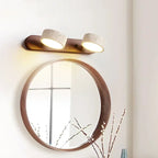 Modern LED wall lamp with rotating shades made of stone and a wooden base