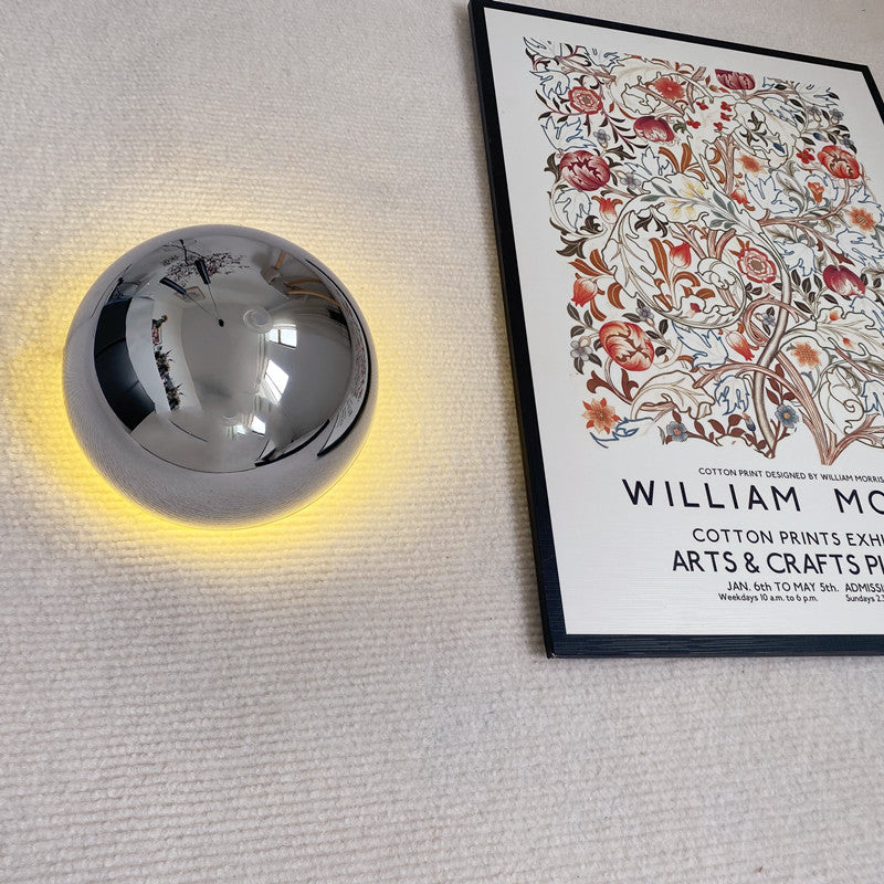 Modern LED wall sconce in the shape of a shimmering ball – wall lighting with a Bauhaus halo effect