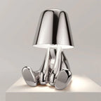Designer LED Table Lamp Sitting Man with Glossy Finish