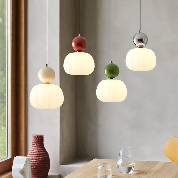 Modern pendant lamp with a spherical decorative element