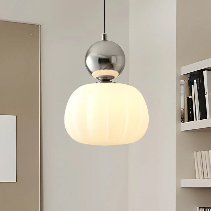 Modern pendant lamp with a spherical decorative element