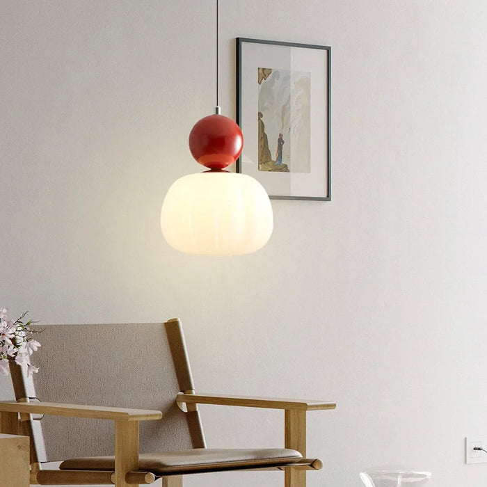 Modern pendant lamp with a spherical decorative element