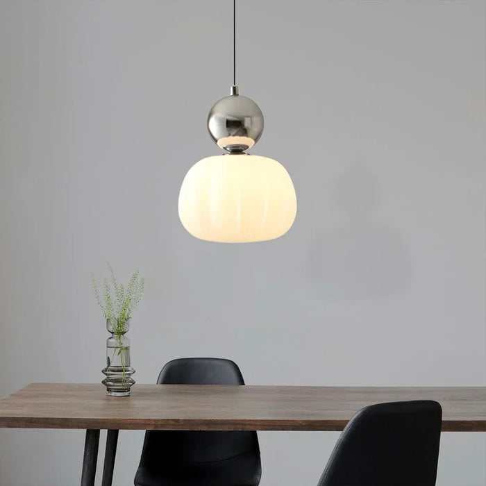 Modern pendant lamp with a spherical decorative element
