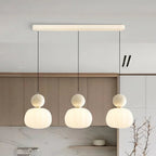 Modern pendant lamp with a spherical decorative element