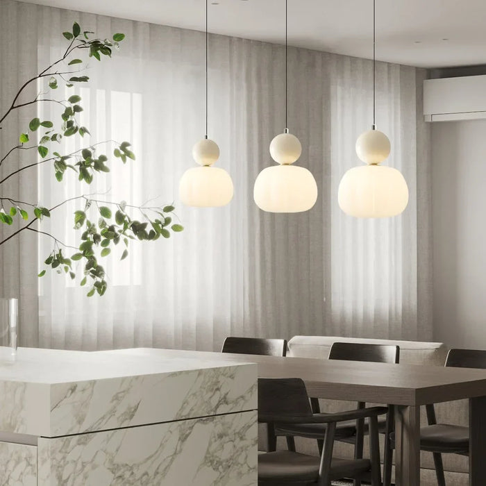 Modern pendant lamp with a spherical decorative element