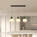 Modern pendant lamp with a spherical decorative element