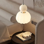 Modern pendant lamp with a spherical decorative element