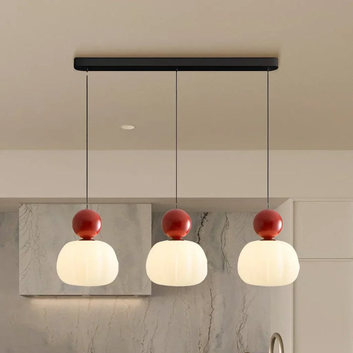 Modern pendant lamp with a spherical decorative element