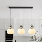 Modern pendant lamp with a spherical decorative element