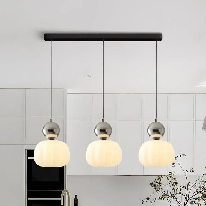 Modern pendant lamp with a spherical decorative element
