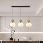 Modern pendant lamp with a spherical decorative element