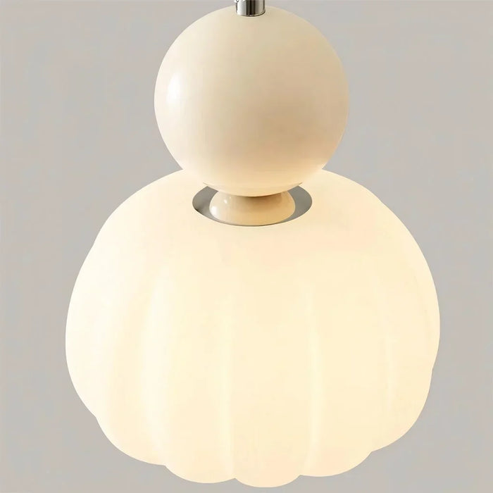Modern pendant lamp with a spherical decorative element