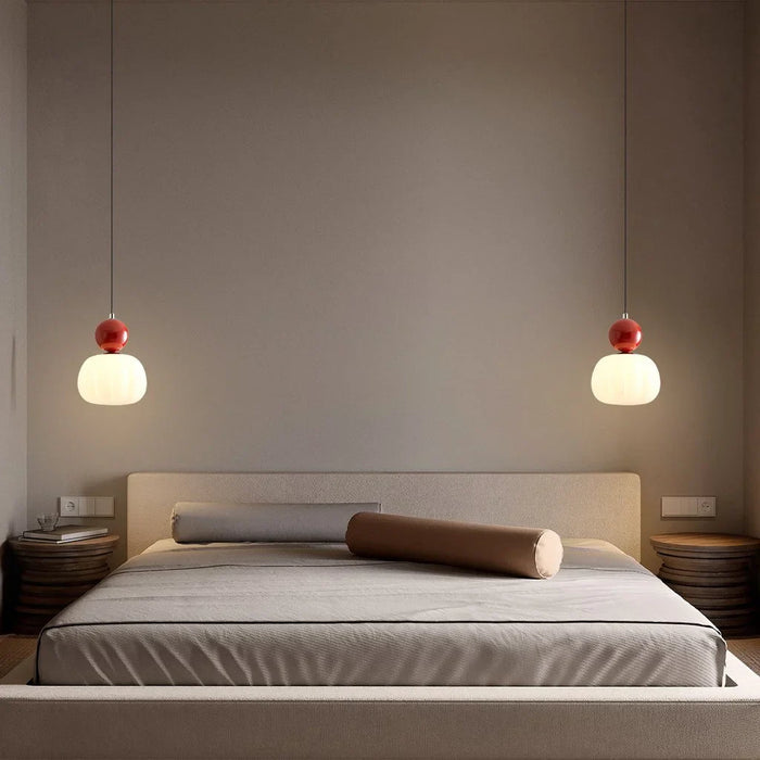 Modern pendant lamp with a spherical decorative element
