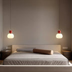 Modern pendant lamp with a spherical decorative element
