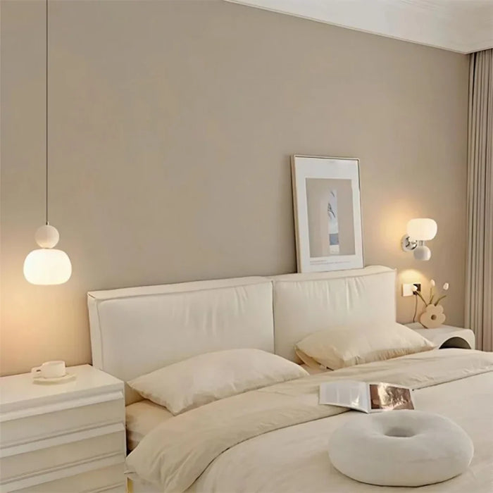 Modern pendant lamp with a spherical decorative element