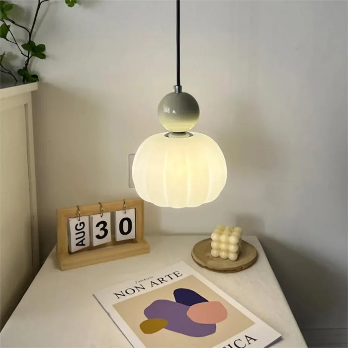 Modern pendant lamp with a spherical decorative element