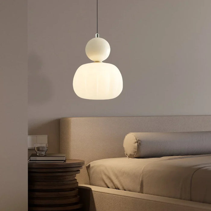 Modern pendant lamp with a spherical decorative element