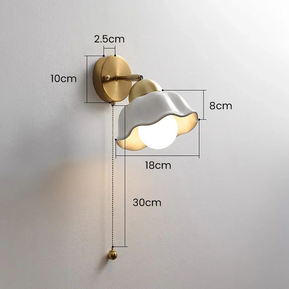 Wall lamp with wavy shade and chain